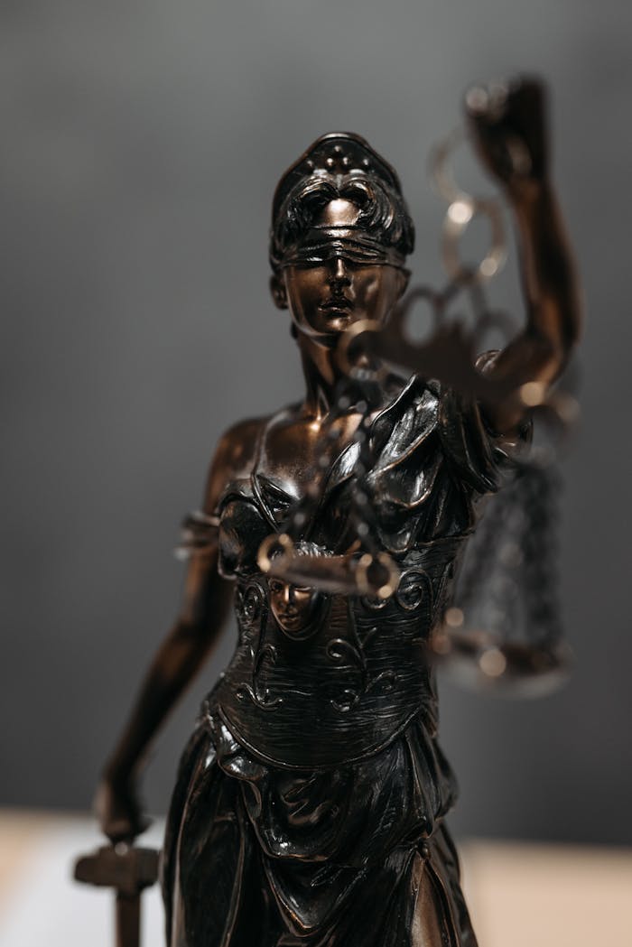 Close-up Photo of Lady Justice Statuette